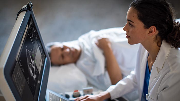 Doctor monitoring patient