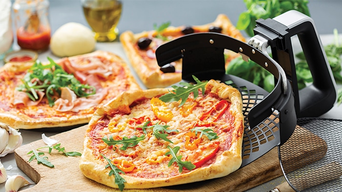 Pizza with tomatoes and arugula